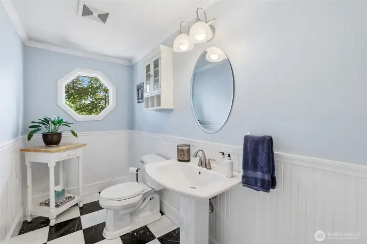 Charming upper-level half bath thoughtfully designed with character and functionality in mind. Charming upper-level half bath thoughtfully designed with character and functionality in mind.