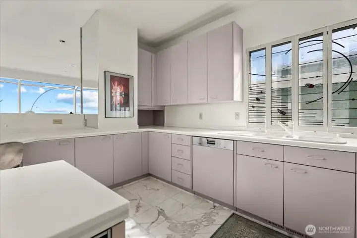 Kitchen with abundant cabinetry, generous workspace, and easy connection to the surrounding living and entertaining areas. Kitchen with abundant cabinetry, generous workspace, and easy connection to the surrounding living and entertaining areas.