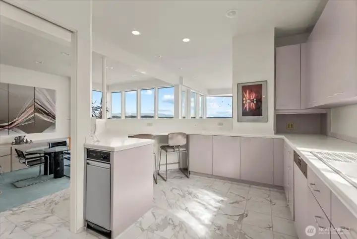 Kitchen layout offers room to prep, gather, and stay connected to the surrounding living spaces. Kitchen layout offers room to prep, gather, and stay connected to the surrounding living spaces.