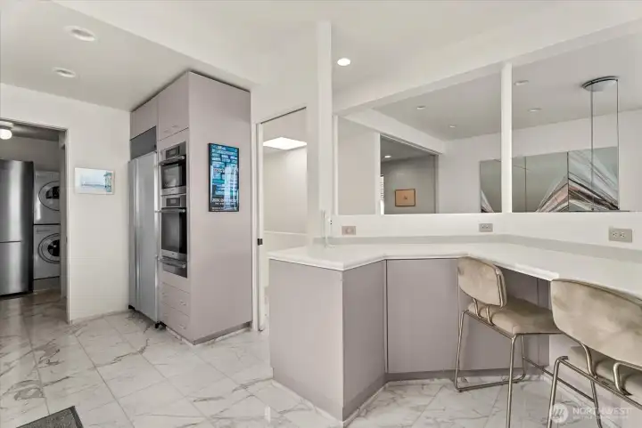 Built-in seating area creates a casual gathering space within the kitchen. Built-in seating area creates a casual gathering space within the kitchen.