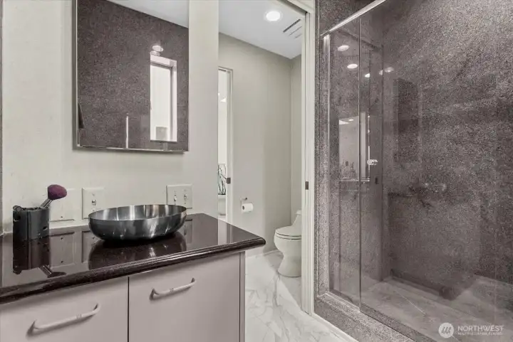 Walk-in shower and generous vanity area create a functional and well-designed bathroom space. Walk-in shower and generous vanity area create a functional and well-designed bathroom space.