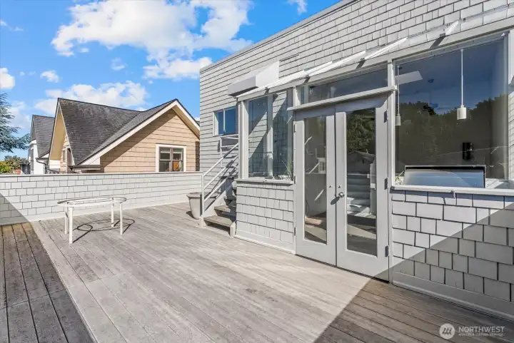 Expansive waterfront deck connected to the glass-enclosed entertaining space. Expansive waterfront deck connected to the glass-enclosed entertaining space.