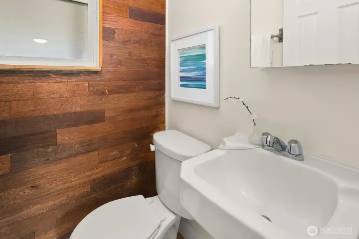 Convenient half bath is near the fourth bedroom or gathering room.