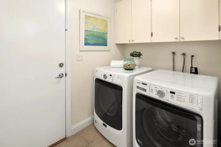 Full sized washer and dryer off the kitchen area