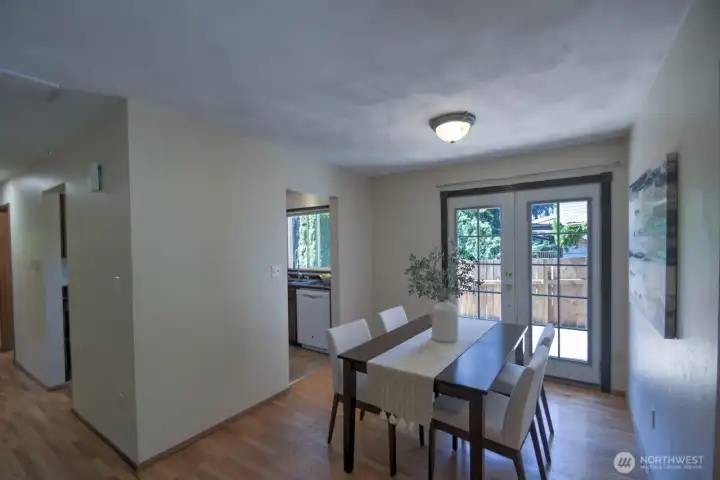 Another view of the dining room and kitchen