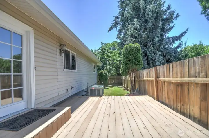 Deck and fully fenced backyard. A heat pump provides year round comfort and there are connections for your future hot tub already in place.