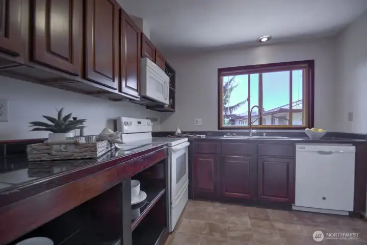 Ample countertops for food prep and a large picture window to enjoy the view while doing the dishes.