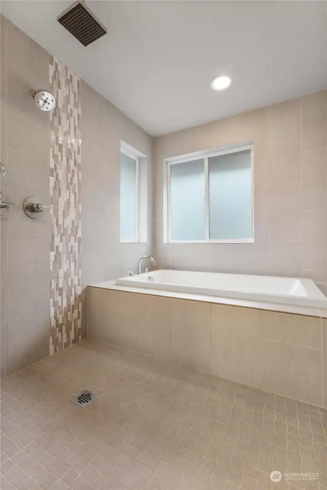 Enjoy a luxurious bubble bath or relax under the rain shower heads