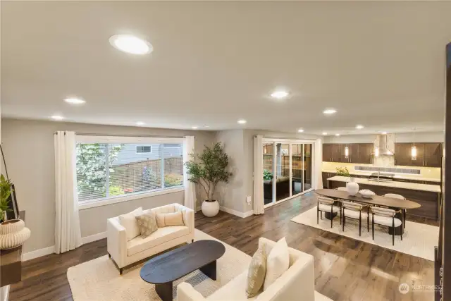 The living area is bathed in light from the 16 foot slider doors that welcome the outdoors in!