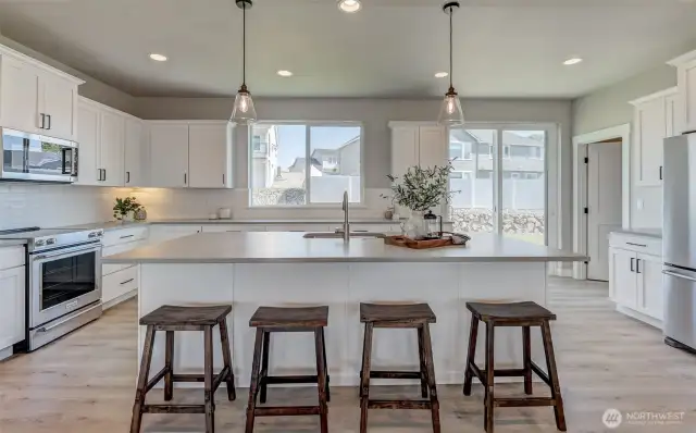Slider off the kitchen to the back yard as well.. Walk in pantry to the right.