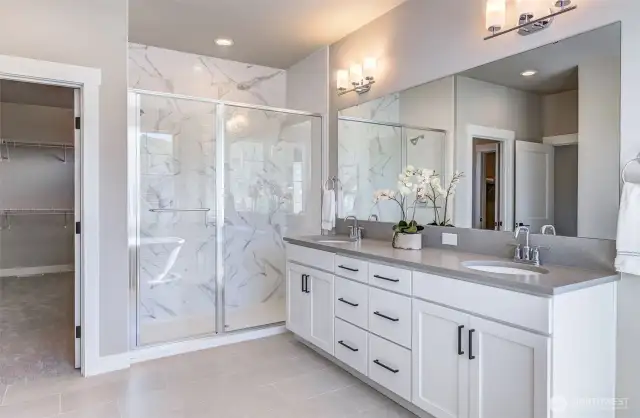 Double vanity, tiled shower.. and the CLOSET..