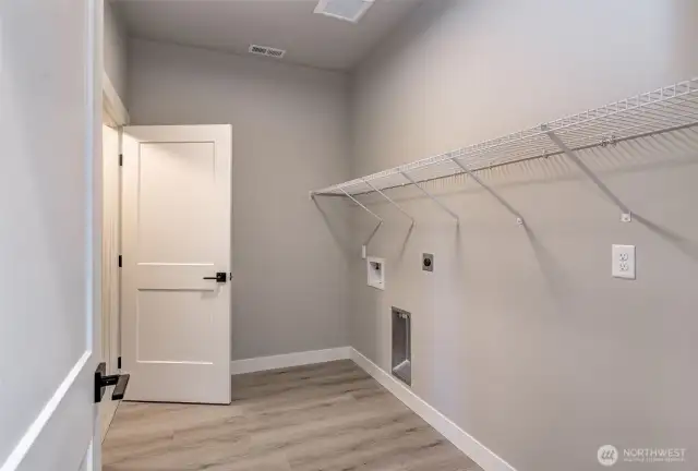 Just to the right is a lower laundry and Super Storage!