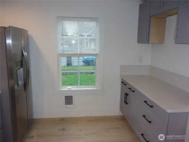 Kitchen eating space plus extra cabinets.
