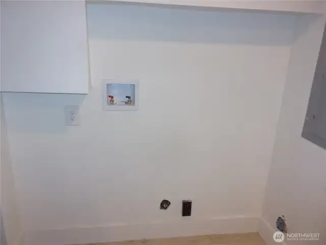 Laundry area off kitchen.