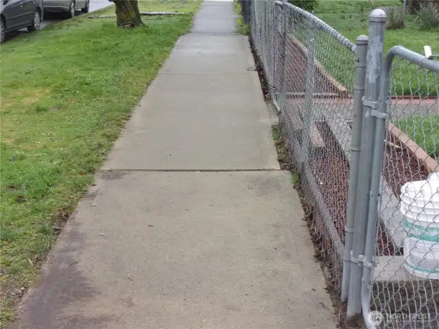 Sidewalk, curb, gutter, and storm drainage along McKinley Avenue.
