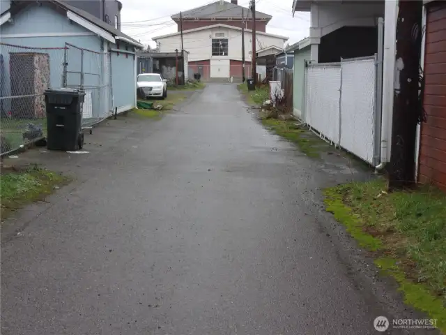 Paved alley access to the back of the property.