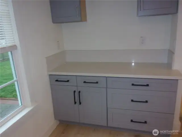 Extra kitchen cabinets and work space.