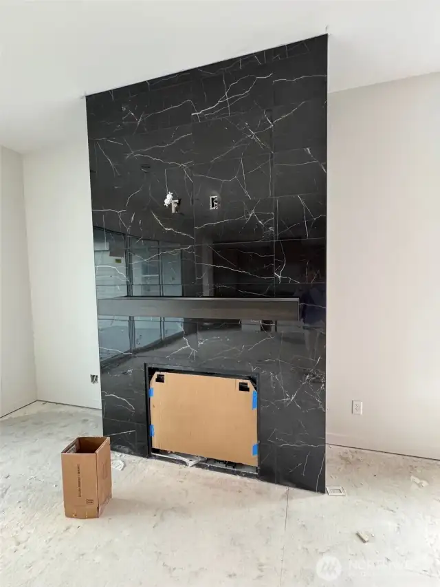 Floor to ceiling tiled fireplace