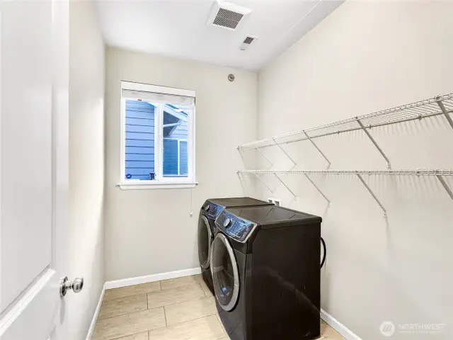 Utility room on the main floor with lots of storage space