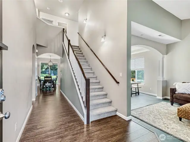 Enter to soaring vaulted ceilings and the great room