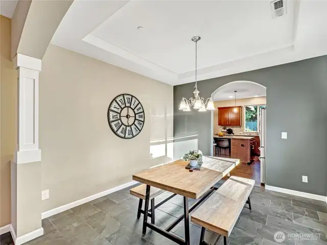 Coved ceilings and arched doorways set this home apart
