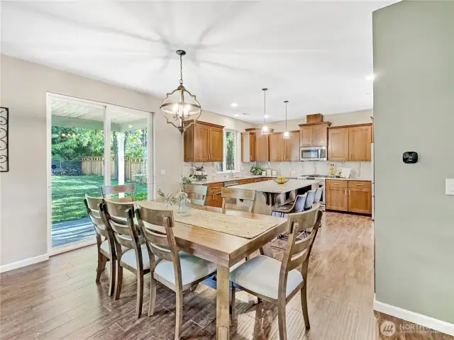 An eating area separates the kitchen & living room creating zones while maintaining an open concept. Perfect for entertaining.