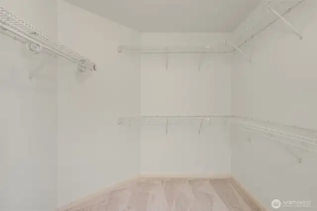 Walk in closet in primary bedroom