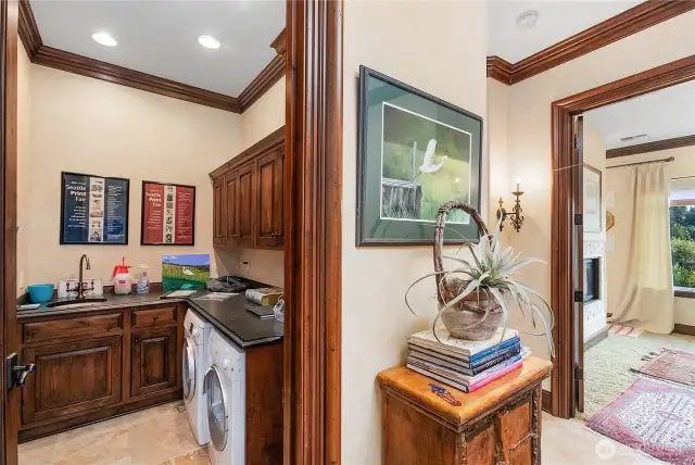 Laundry room with plenty of storage and utility sink