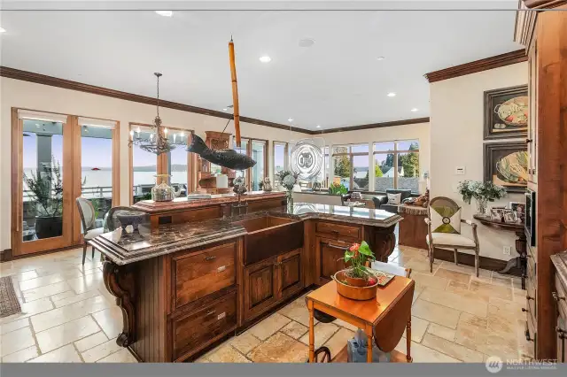 Marble counters, Tumbled travertine floors, Live Edge Madrona slab, Bold & intricate trim, Hammered Copper sink, Hickory cabinets throughout