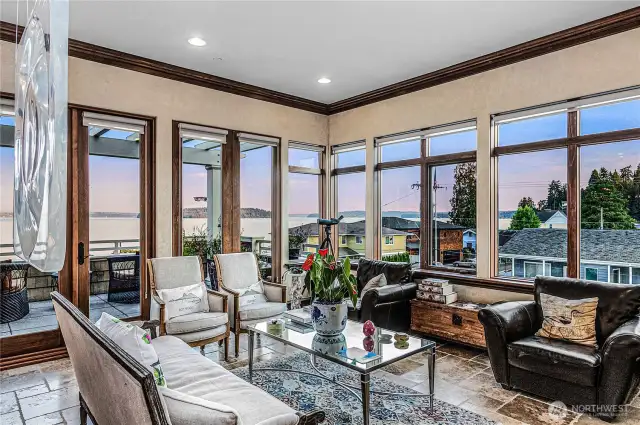 Living room boasting giant windows that allow views from Seattle to Mt Rainier