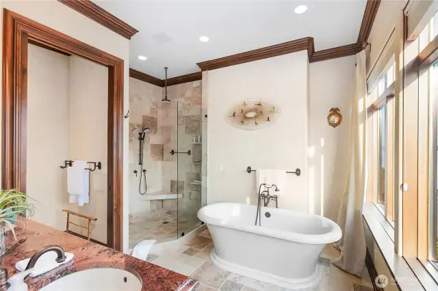 Luxurious 5 piece bathroom attached to primary suite with free standing tub