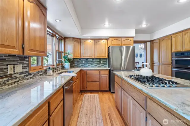 Gourmet Kitchen connects both formal and casual dining spaces
