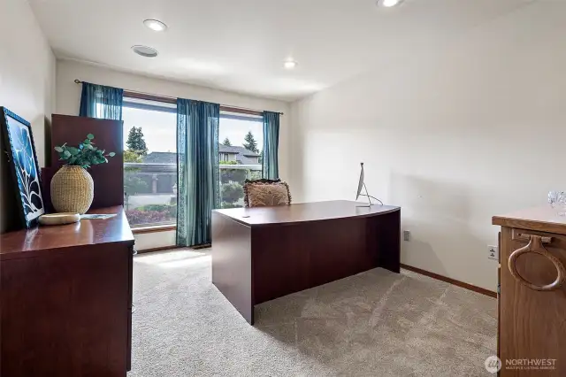 Private den with wet bar behind french doors