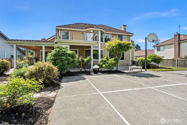 Backyard is huge with sport, entertaining, and mature landscaped grounds