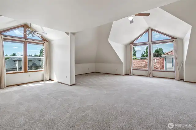 This bonus room is HUGE! Ample light steams in and wet bar