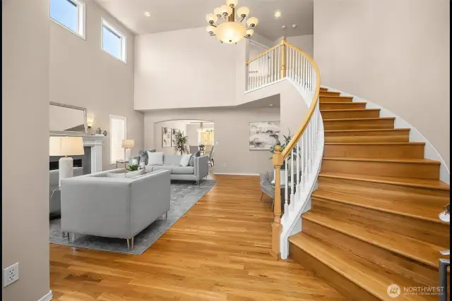 The foyer showcases soaring ceilings & abundant windows that fill every space with light.