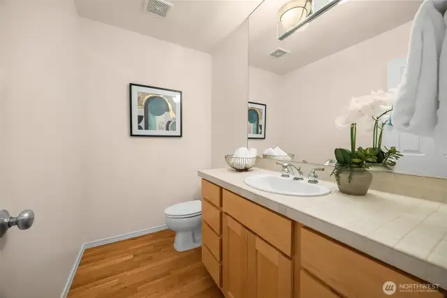 Large half bath on the main floor is easily accessed for guests, or rework this space and adjacent laundry room to create a 3/4 bath for a main floor primary.