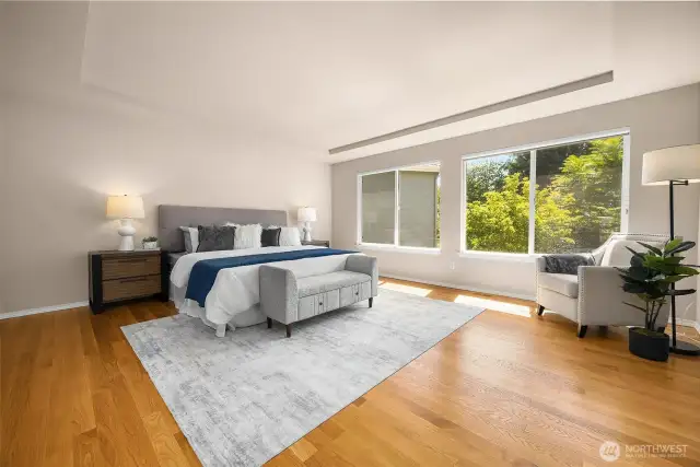 The homeowner replaced carpet on the 2nd level with hardwoods to match the main floor, which make this large primary bedroom feel even larger!