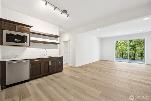 Lower level with wet bar, living room, bedroom, and 3/4 bath.
