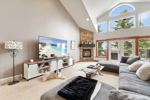 Beautiful stone fireplace and french doors to deck