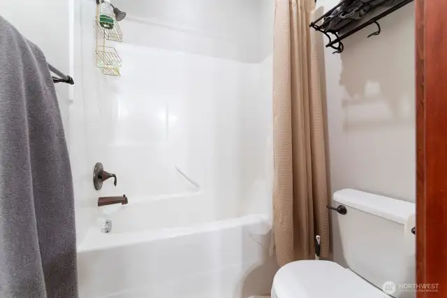 Enclosed shower and toilet to the Jack and Jill Bathroom.
