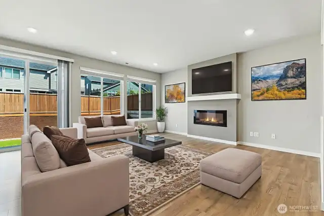 Open concept floor plan is perfect for today's lifestyle. The wall of windows brings the outside in. This room is virtually staged