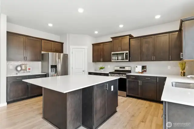 This kitchen features plenty of storage and offers the ideal layout for gatherings.