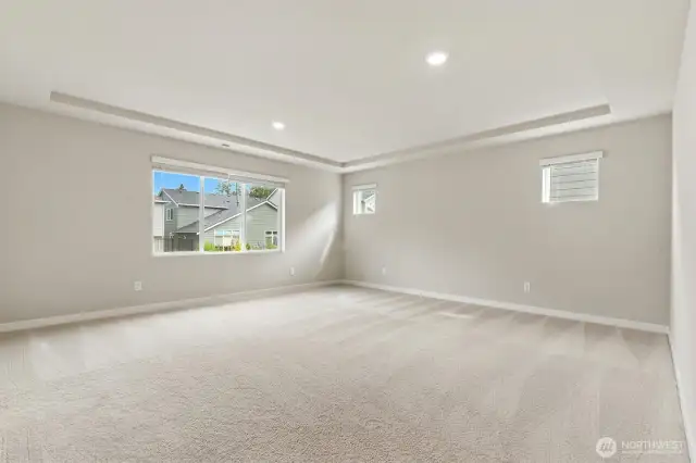 Upper level primary bedroom is spacious for your bed, furniture and offers room for a desk or sitting area.