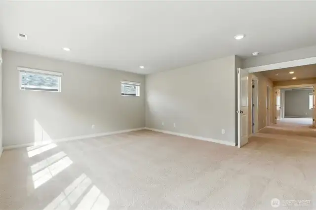 Upper level Bonus Room with double French doors opens to generous upper level hallway.