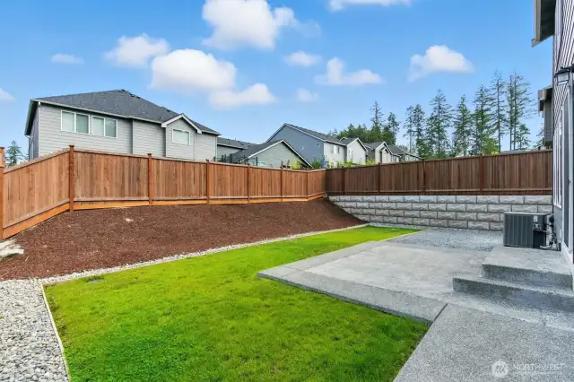 The level grass area is ready for your lawn toys or garden beds.