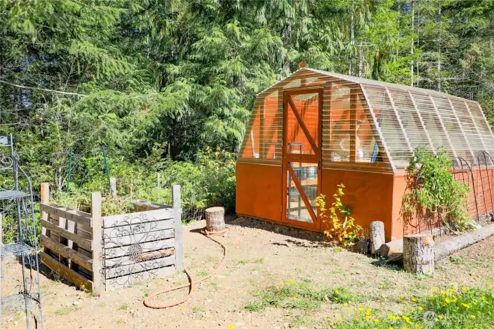 Greenhouse on the lower level of property.