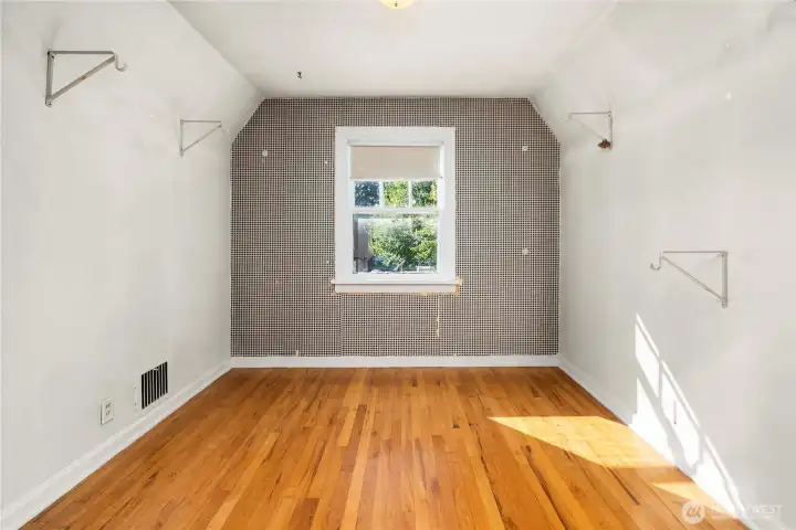 Walk-in closet attached to one of the upstairs bedrooms.