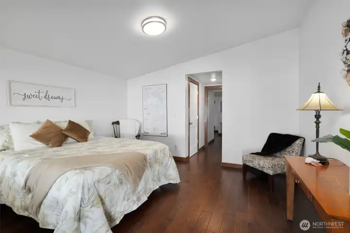 Spacious primary bedroom with walk-in closet and private 3/4 bathroom.