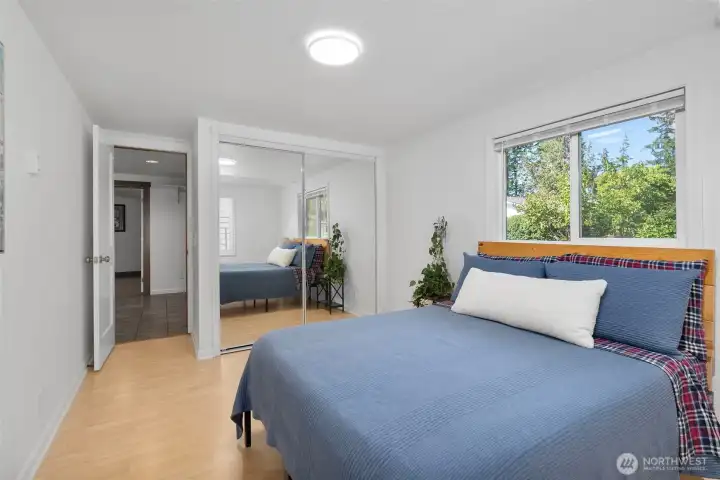 2nd bedroom with laminate wood flooring.